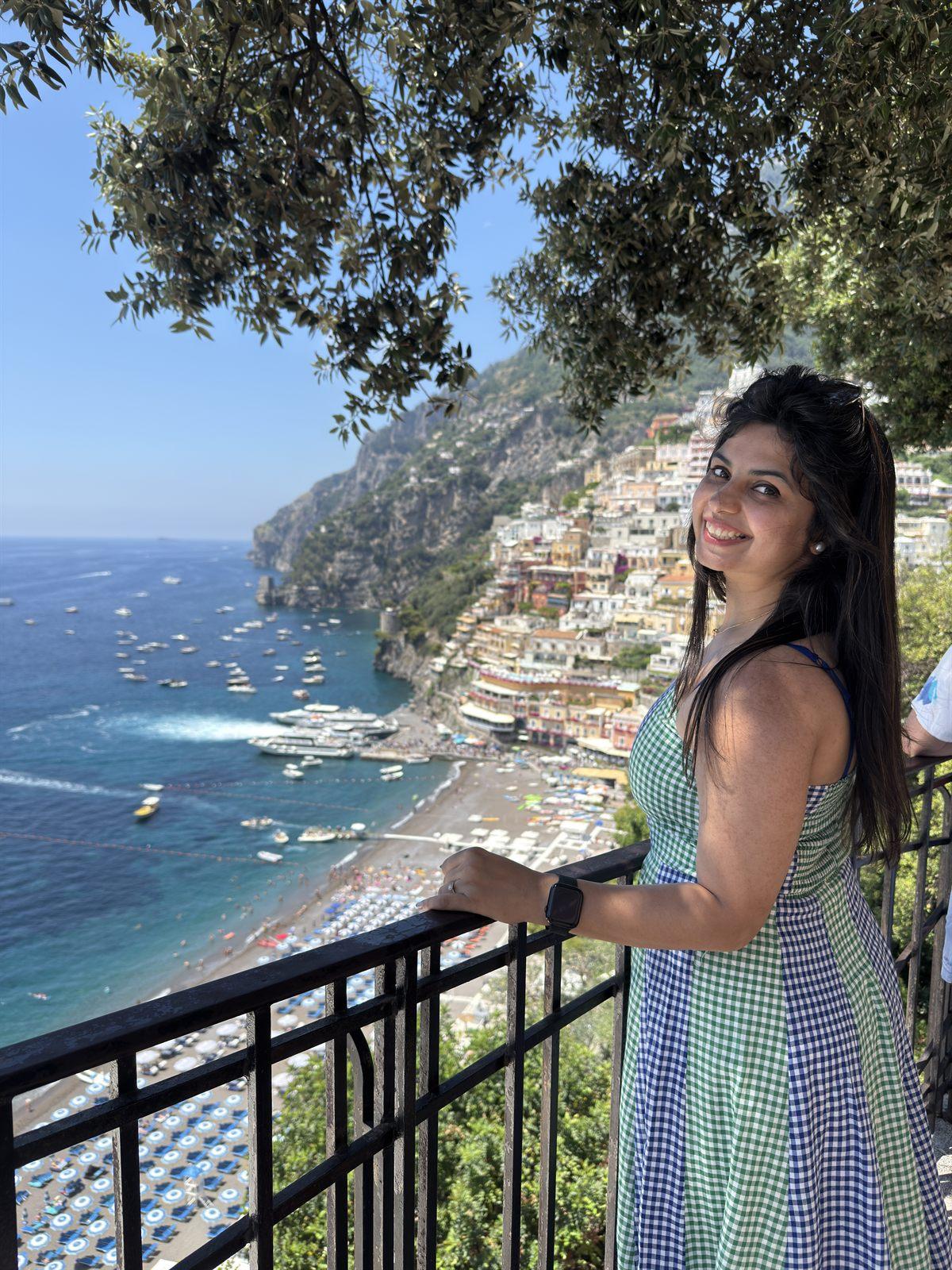 Nikita Thakkar, founder of Yumora, on a terrace above the sea